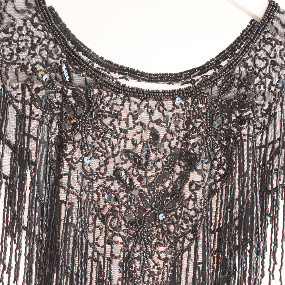 Capa flecos, Back to Black